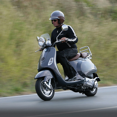 VESPA® LXV 150 - Modern technology meets vintage styling with this Vespa® scooter.  Features a 150cc four-stroke engine that reaches speeds up to 59 mph.